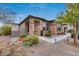 Landscaped front yard with stone pathway and lighting at 17957 W Fairview St, Goodyear, AZ 85338