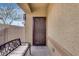 Front entry with covered porch and decorative screen door at 17957 W Fairview St, Goodyear, AZ 85338