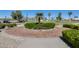 Circular garden with brick walkway and lush shrubs at 17957 W Fairview St, Goodyear, AZ 85338