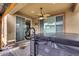 Relaxing backyard hot tub with covered patio at 17957 W Fairview St, Goodyear, AZ 85338