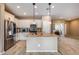 Modern kitchen featuring white cabinets and granite countertops at 17957 W Fairview St, Goodyear, AZ 85338