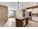 Kitchen with island, stainless steel appliances, and granite countertops at 17957 W Fairview St, Goodyear, AZ 85338