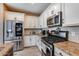 Kitchen features stainless steel appliances and granite countertops at 17957 W Fairview St, Goodyear, AZ 85338