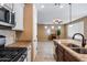 Kitchen with island, stainless steel appliances, and granite countertops at 17957 W Fairview St, Goodyear, AZ 85338