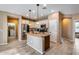 Open kitchen with island, stainless steel appliances, and granite countertops at 17957 W Fairview St, Goodyear, AZ 85338