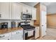 Kitchen features gas range, microwave, and granite countertops at 17957 W Fairview St, Goodyear, AZ 85338
