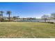Expansive lake view with lush green space at 17957 W Fairview St, Goodyear, AZ 85338