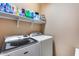 Laundry room with washer, dryer and shelving at 17957 W Fairview St, Goodyear, AZ 85338