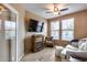 Living room featuring a fireplace, television and comfortable seating at 17957 W Fairview St, Goodyear, AZ 85338