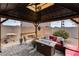 Cozy patio with fire pit, seating area, and pergola at 17957 W Fairview St, Goodyear, AZ 85338