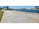 Concrete walkway along the lake, offering scenic views at 17957 W Fairview St, Goodyear, AZ 85338