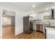 Modern kitchen with white cabinets and stainless steel appliances at 1825 W Roma Ave, Phoenix, AZ 85015