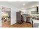 Modern kitchen with white cabinets and stainless steel appliances at 1825 W Roma Ave, Phoenix, AZ 85015