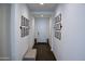 Bright hallway with wood floors and framed art at 21231 E Domingo Rd, Queen Creek, AZ 85142