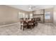 Dining area with stone fireplace and tile floors at 219 W Kathleen Rd, Phoenix, AZ 85023