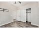 Bedroom with sliding closet doors and wood-style flooring at 23006 W Micah Way, Buckeye, AZ 85326