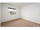 Bright bedroom with carpet flooring, ceiling fan, and window at 2717 E Cinnabar Ave, Phoenix, AZ 85028