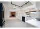 Modern kitchen with white cabinets and brick fireplace at 2717 E Cinnabar Ave, Phoenix, AZ 85028