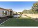 Landscaped backyard with artificial turf and pool at 3114 E Wildhorse Ct, Gilbert, AZ 85297