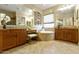 Elegant bathroom with a large soaking tub and dual vanities at 3114 E Wildhorse Ct, Gilbert, AZ 85297