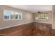 Living room with bay window, hardwood floors and ceiling fan at 324 W Willow Ave, Phoenix, AZ 85029