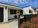 Modern house with white exterior, dark accents, and landscaped yard at 4002 N 85Th St, Scottsdale, AZ 85251