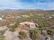 Aerial view of a single-story home with a pool in a desert setting at 44821 N 12Th St, New River, AZ 85087