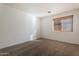 Bright bedroom featuring neutral wall tones and carpeted flooring at 5426 W Ian Dr, Laveen, AZ 85339