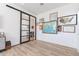 Home office with wall of maps and sliding barn door at 5750 S 101St Way, Mesa, AZ 85212