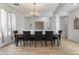 Bright dining room featuring a large table and six chairs at 7727 S 22Nd Ln, Phoenix, AZ 85041