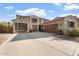 Two-story house with a large driveway and landscaped yard at 7727 S 22Nd Ln, Phoenix, AZ 85041