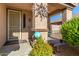 Covered front porch with decorative sunburst and security system at 7921 S 26Th Dr, Phoenix, AZ 85041