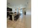 Open concept kitchen with an island and a view into the living room at 11057 E Verbina Ln, Florence, AZ 85132