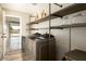 Laundry room with washer, dryer, and custom shelving at 14409 N 42Nd St, Phoenix, AZ 85032