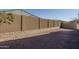 Landscaped backyard with block wall fencing at 14851 S 179Th Ave, Goodyear, AZ 85338