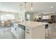 Modern kitchen island with white cabinets and quartz countertops at 15839 N 19Th St, Phoenix, AZ 85022