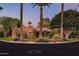 Spanish-style home with landscaped yard and palm trees at 1603 Palmcroft Se Dr, Phoenix, AZ 85007