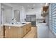 Bright kitchen featuring an island and white shaker cabinets at 1604 E Sheena Dr, Phoenix, AZ 85022