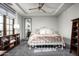 Charming bedroom with an ornate bed frame and built-in shelving at 19149 N 99Th St, Scottsdale, AZ 85255