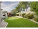 Landscaped backyard with putting green and playset at 19149 N 99Th St, Scottsdale, AZ 85255