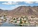 Aerial view of waterfront homes and neighborhood, showing lake and mountain landscape at 21229 N 52Nd Ave, Glendale, AZ 85308