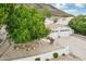 Two-story house with a two-car garage, mature trees, and landscaping at 21229 N 52Nd Ave, Glendale, AZ 85308