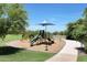 Community playground with shaded play area at 2466 N 212Th Ln, Buckeye, AZ 85396