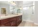 Elegant bathroom with double vanity, granite countertops, and a walk-in shower at 24816 S Pleasant Ct, Sun Lakes, AZ 85248