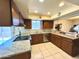 Bright kitchen features granite countertops and ample cabinetry at 25620 S Cloverland Dr, Sun Lakes, AZ 85248