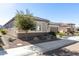 Single story home with a two-car garage and desert landscaping at 26493 W Piute Ave, Buckeye, AZ 85396