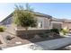 Single story home with a two-car garage and neatly landscaped yard at 26493 W Piute Ave, Buckeye, AZ 85396