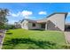 Large backyard with artificial turf and mature trees at 2860 N Riverdale Ln, Casa Grande, AZ 85122