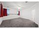 Spacious bedroom with carpet flooring and red curtains at 2860 N Riverdale Ln, Casa Grande, AZ 85122
