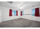 Bright bedroom featuring ceiling fan and neutral carpeting at 2860 N Riverdale Ln, Casa Grande, AZ 85122